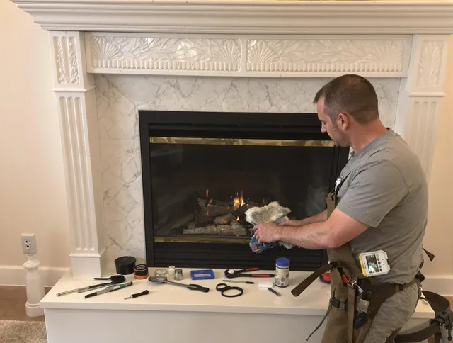 Acushnet Chimney Sweep performing fireplace maintenance in Acushnet, MA