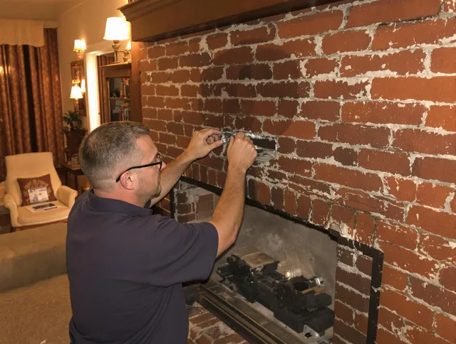 Acushnet Chimney Sweep expert fixing a fireplace in Acushnet, MA